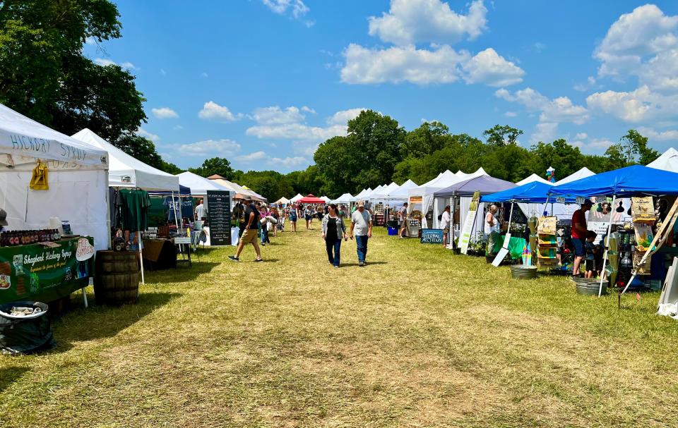 Festival goers walk among more than 200 vendors featured at the second annual Homestead Festival.
