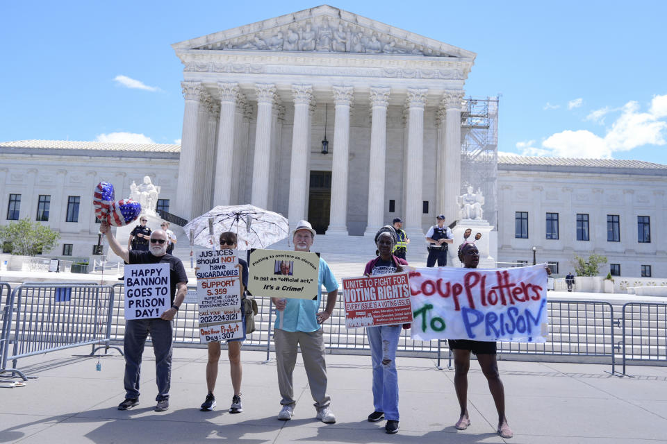 People protest outside the Supreme Court Monday, July 1, 2024, in Washington. (AP Photo/Mariam Zuhaib)