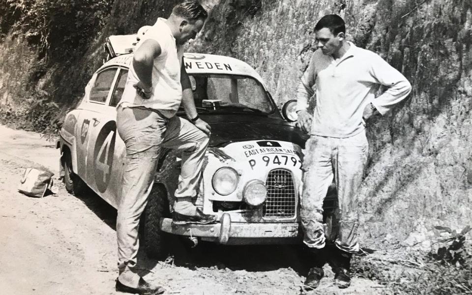 Erik Carlsson and Gunnar Palm survey the damage after their Saab 96 clobbered an aardvark during the night - Safari Rally 1963 - Gunnar Palm Collection