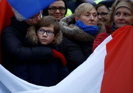 Demonstrators holding Polish and EU flags gather outside the Parliament building during a protest in Warsaw, Poland, December 17, 2016. REUTERS/Kacper Pempel