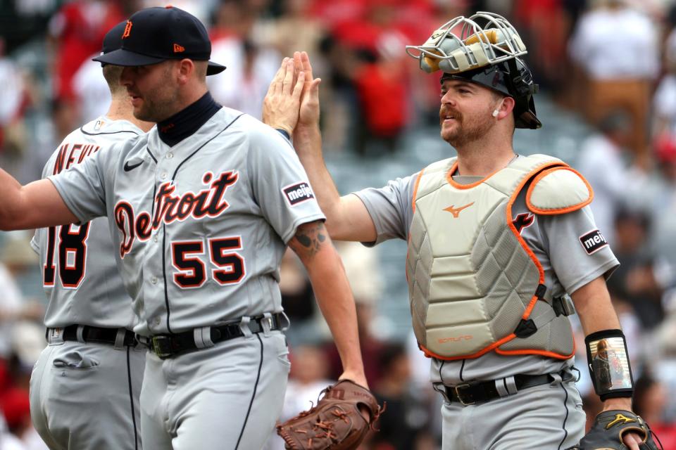 Detroit Tigers catcher Jake Rogers (34) and third baseman Tyler Nevin (18) celebrate a victory after defeating the Los Angeles Angels 5-3 at Angel Stadium