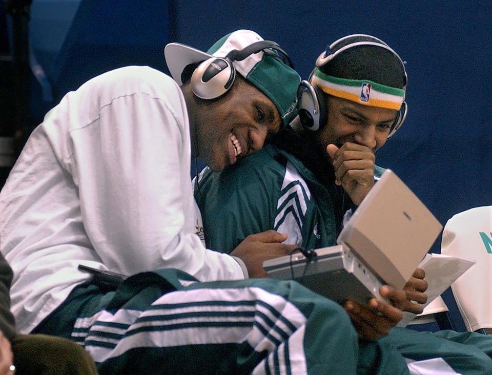 LeBron James has a few laughs with St. Vincent-St. Mary teammate Brandon Weems as the two play a video game before the Irish's game against Mentor on Jan. 14, 2003, at the University of Akron's Rhodes Arena.