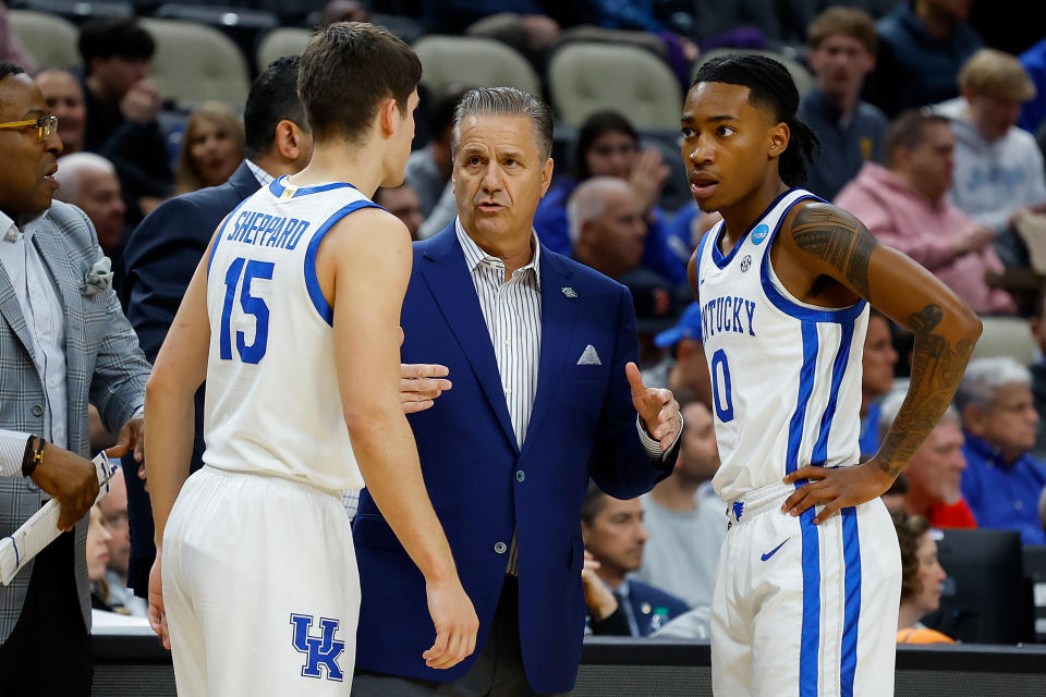 PITTSBURGH, PENNSYLVANIA - MARCH 21: head coach John Calipari of the Kentucky Wildcats talks with Reed Sheppard #15 and Rob Dillingham #0 in the first half of the game against the Oakland Golden Grizzlies during the first round of the 2024 NCAA Men's Basketball Tournament held at PPG PAINTS Arena on March 21, 2024 in Pittsburgh, Pennsylvania. (Photo by Justin K. Aller/NCAA Photos via Getty Images)