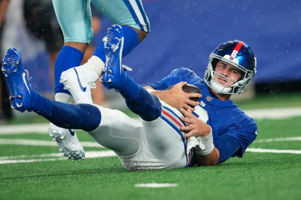 New York Giants quarterback <a class="link " href="https://sports.yahoo.com/nfl/players/31838" data-i13n="sec:content-canvas;subsec:anchor_text;elm:context_link" data-ylk="slk:Daniel Jones;sec:content-canvas;subsec:anchor_text;elm:context_link;itc:0">Daniel Jones</a> (8), is shown on the ground after being sacked by Dallas Cowboys linebacker <a class="link " href="https://sports.yahoo.com/nfl/players/33400" data-i13n="sec:content-canvas;subsec:anchor_text;elm:context_link" data-ylk="slk:Micah Parsons;sec:content-canvas;subsec:anchor_text;elm:context_link;itc:0">Micah Parsons</a> (not shown) in the first quarter. Sunday, September 10, 2023