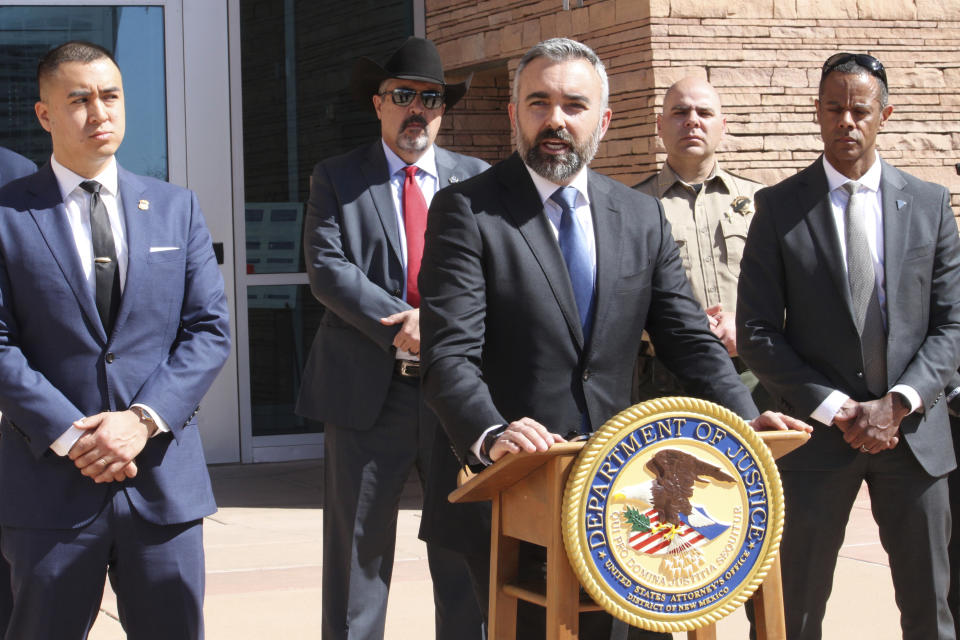 New Mexico Attorney General Raul Torrez, center, discusses the case of a South Carolina man accused of killing a New Mexico police officer, during a news conference In Albuquerque, N.M.,, on Friday, March 22, 2024. The defendant, Jeremy Smith, made his initial appearance in U.S. district court on Friday and was placed in federal custody. (AP Photo/Susan Montoya Bryan)