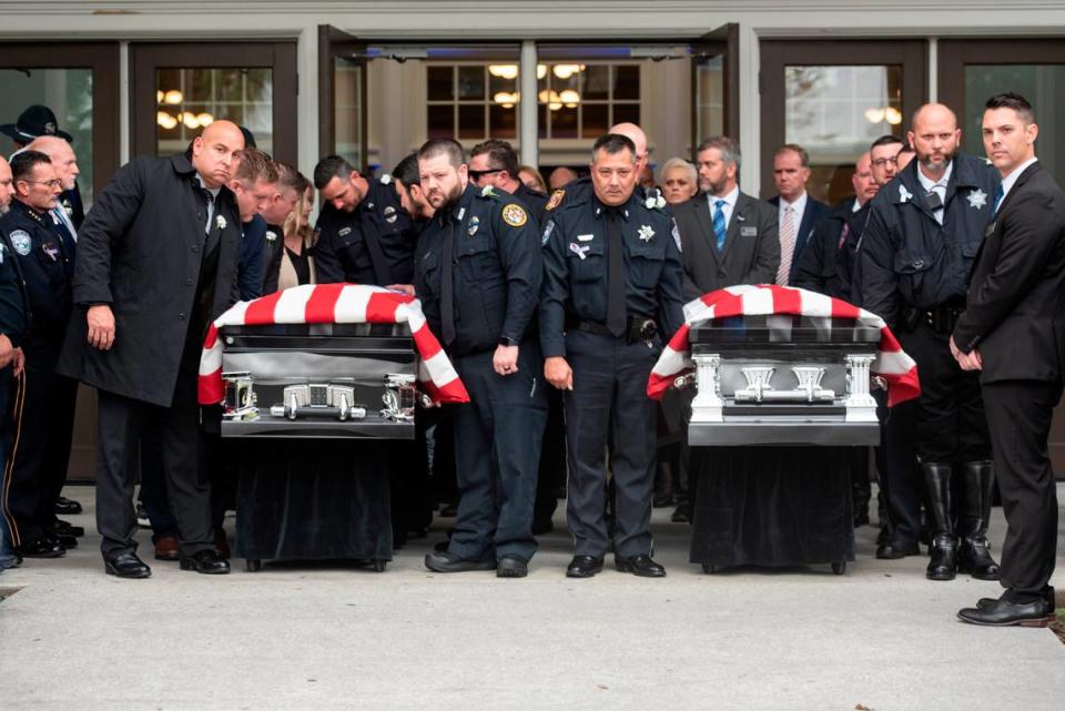Law enforcement officers prepare to carry the caskets of Bay St. Louis police officers Sgt. Steven Robin and Branden Estorffe following their funeral at the Bay St. Louis Community Center in Bay St. Louis on Wednesday, Dec. 21, 2022. Robin and Estorffe were killed responding to a call at a Motel 6 on Dec. 14.