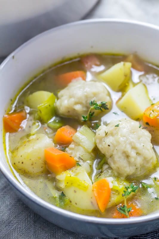 <p>The Cook Report</p><p>The vegetable soup with dumplings recipe is so quick and simple to make. Add whatever vegetables you like to make it your own and make sure you serve up plenty of those dumplings on top!</p><p><strong>Get the recipe: <a href="https://thecookreport.co.uk/vegetable-soup-dumplings/" rel="nofollow noopener" target="_blank" data-ylk="slk:Vegetable Soup with Vegetarian Dumplings;elm:context_link;itc:0;sec:content-canvas" class="link rapid-noclick-resp"><em>Vegetable Soup with Vegetarian Dumplings</em></a></strong></p>