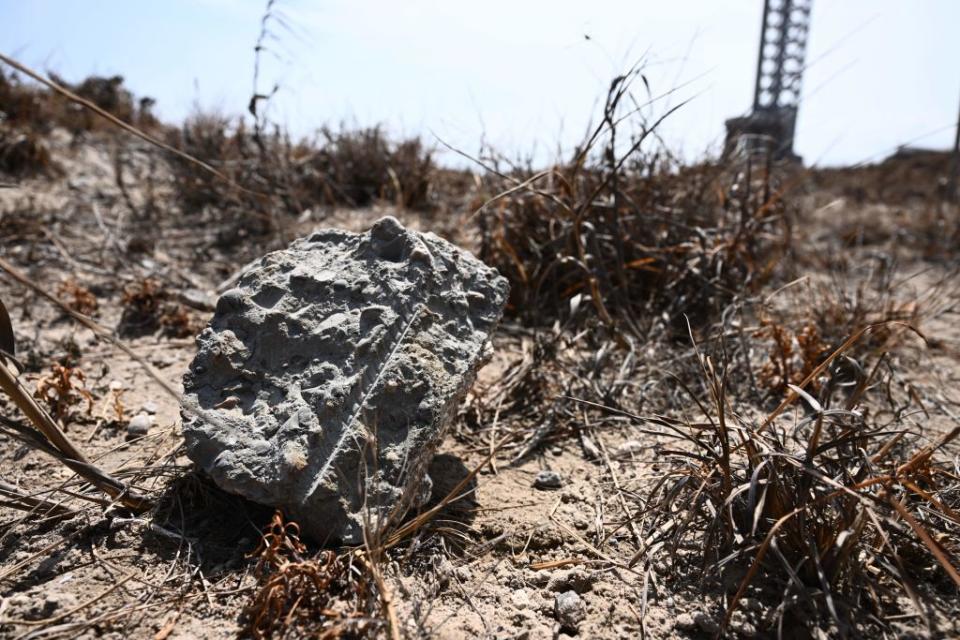 A piece of concrete blown off the launch pad litters the ground on April 22, 2023, after the SpaceX Starship lifted off on April 20 for a flight test from Starbase in Boca Chica, Texas.<span class="copyright">PATRICK T. FALLON/AFP—Getty Images</span>