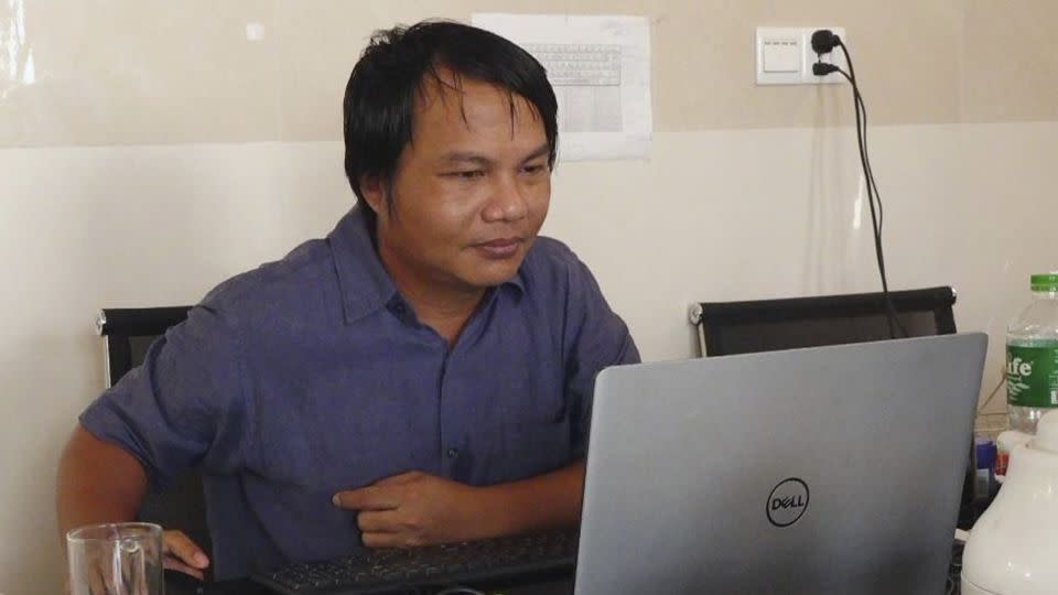 Sai Zaw Thaike, a photojournalist for the independent news website Myanmar Now, works at his desk in Yangon, Myanmar in August 2020.  - Myanmar Now/AP