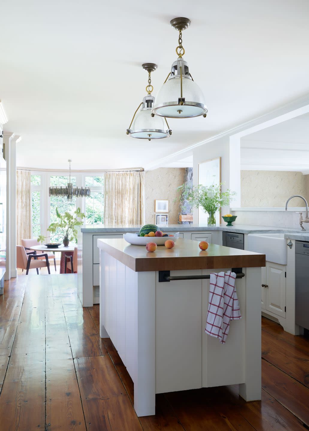 a kitchen with a table and chairs