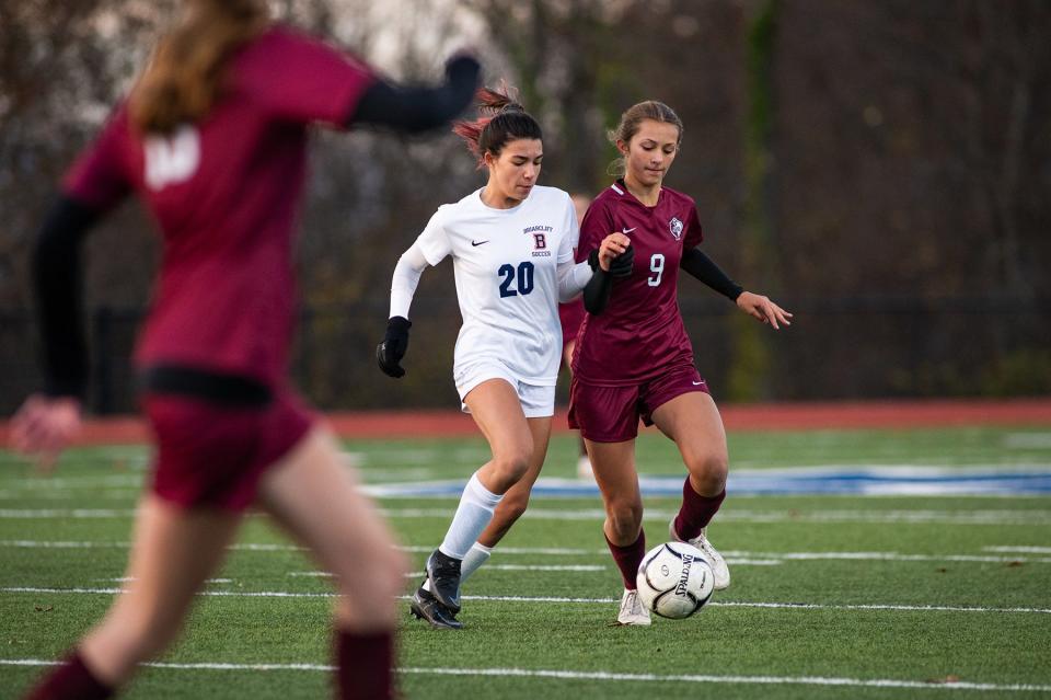 Briarcliff's Lily Rowe, left, and O'Neill's Alyssa Bluman chase after the ball during the girls Class B subregional soccer game in Wallkill, NY on Wednesday, November 1, 2023. O'Neill defeated Briarcliff in double overtime 3-2. KELLY MARSH/FOR THE TIMES HERALD-RECORD