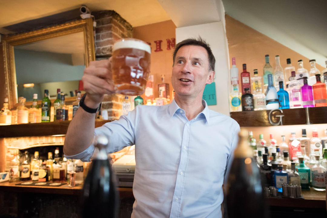 Foreign Secretary and Tory leadership candidate Jeremy Hunt visits pulls a pint at The Keep pub in Guildford, Surrey during a campaigning visit to the area.