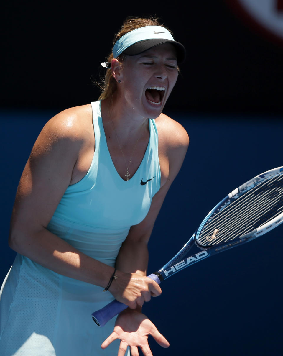 Maria Sharapova of Russia reacts during her second round match against Karin Knapp of Italy at the Australian Open tennis championship in Melbourne, Australia, Thursday, Jan. 16, 2014.(AP Photo/Aaron Favila)