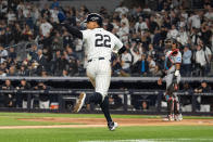 New York Yankees' Juan Soto gestures while approaching home plate on an RBI double by Giancarlo Stanton in the fifth inning of a baseball game against the Miami Marlins, Tuesday, April 9, 2024, in New York. (AP Photo/Peter K. Afriyie)