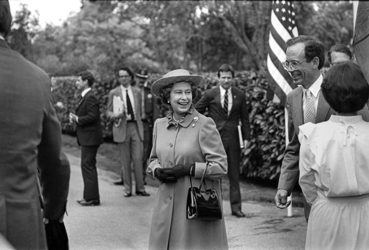 Queen Elizabeth II during a 1983 tour of California. <a href="https://www.gettyimages.com/detail/news-photo/queen-elizabeth-ii-departs-hoover-house-following-lunch-at-news-photo/1317022486?adppopup=true" rel="nofollow noopener" target="_blank" data-ylk="slk:George Rose/Getty Images;elm:context_link;itc:0;sec:content-canvas" class="link ">George Rose/Getty Images</a>