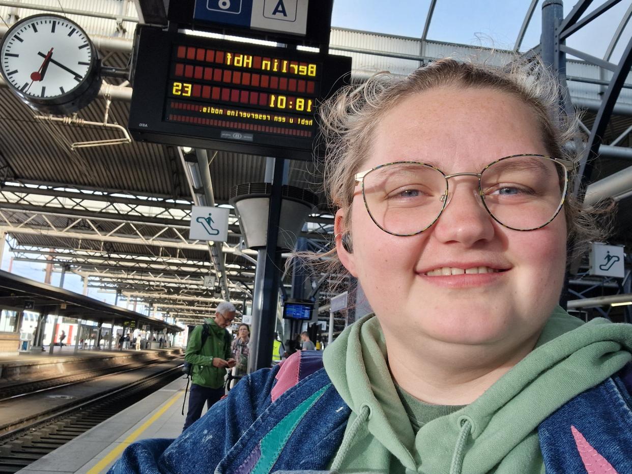 Rachael Davies in front of train to berlin