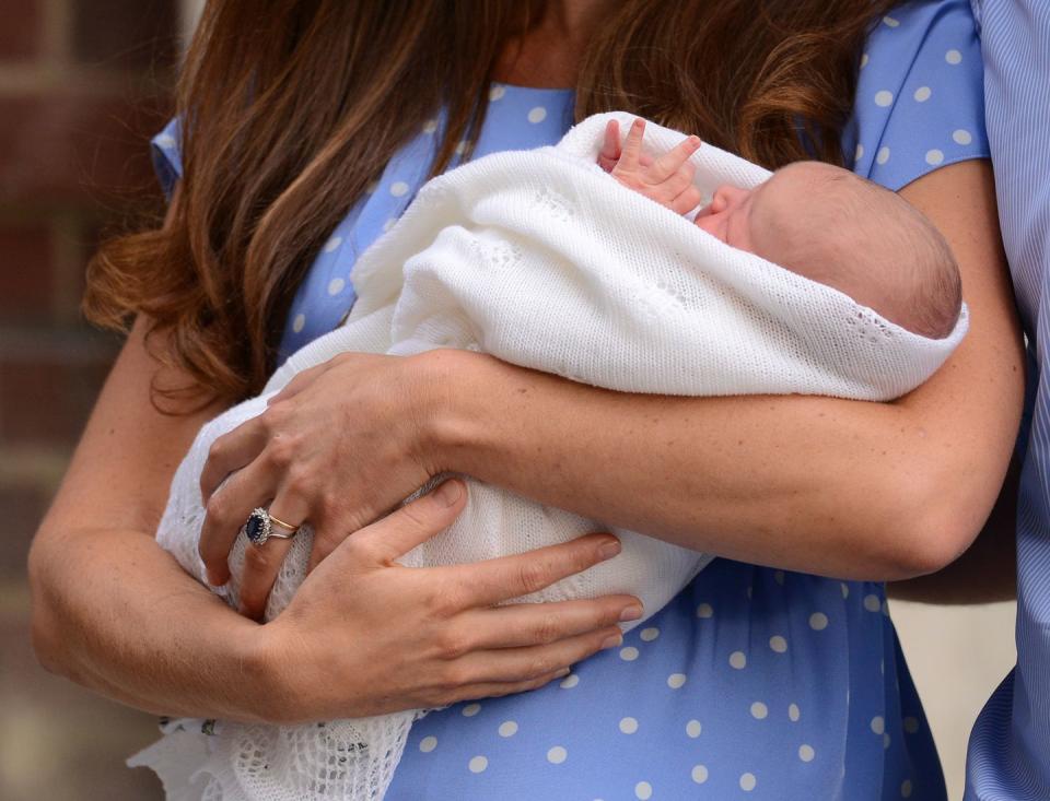 <p>Often overshadowed by her stunning engagement ring, Kate's wedding band is made of Welsh gold. She's seen here debuting the newborn Prince George on the steps of the <a href="https://www.townandcountrymag.com/society/tradition/a23798094/lindo-wing-st-marys-hospital-facts-photos/" rel="nofollow noopener" target="_blank" data-ylk="slk:Lindo Wing;elm:context_link;itc:0;sec:content-canvas" class="link ">Lindo Wing</a> on July 23, 2013. <br></p><p><strong>More</strong>: <a href="https://www.townandcountrymag.com/style/jewelry-and-watches/g13060157/famous-royal-engagement-rings/" rel="nofollow noopener" target="_blank" data-ylk="slk:Famous Royal Engagement Rings;elm:context_link;itc:0;sec:content-canvas" class="link ">Famous Royal Engagement Rings</a> </p>