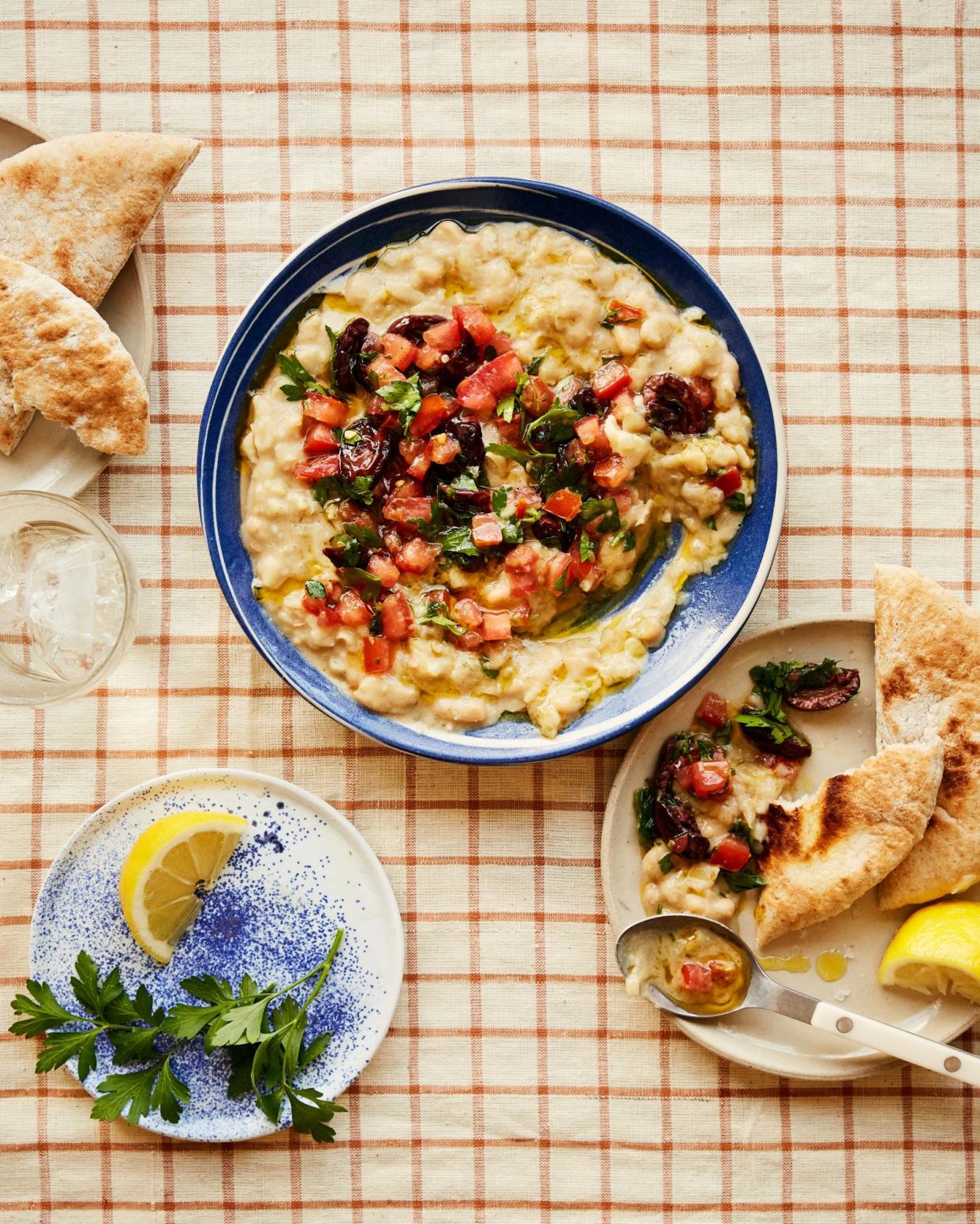 <span>Georgina Hayden’s ful medames with charred olives.</span><span>Photograph: Matthew Hague/The Guardian. Food and prop styling: Lucy Turnbull. Food styling assistant: Katie Smith.</span>