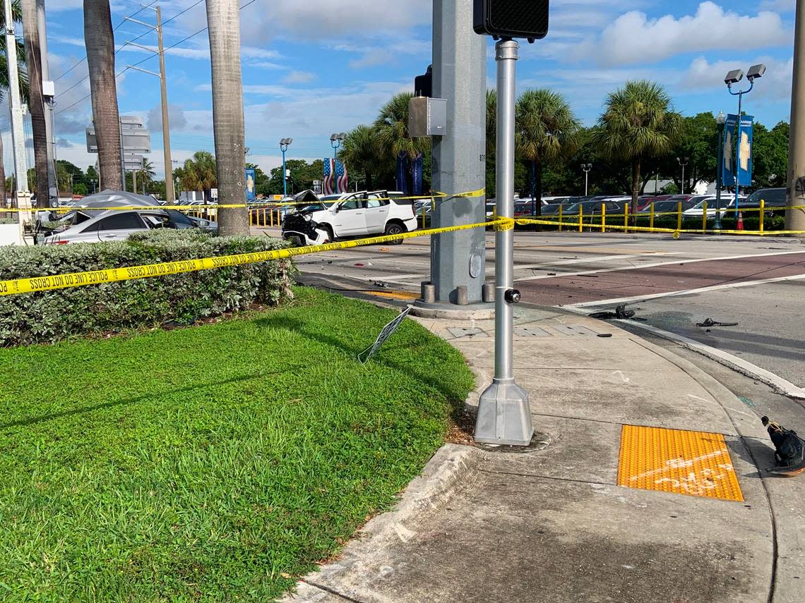 The white SUV in the middle of Southwest Eighth Street and the passenger side of the gray sedan after the Labor Day three-car, hit-and-run crash at Southwest Eighth Street and LeJeune Road.