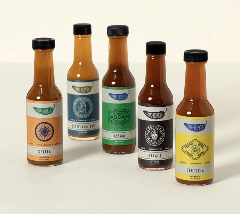 <p><strong>Brandon Clark and Don Hopkins</strong></p><p>Uncommon Goods </p><p><strong>$45.00</strong></p><p>If spicy food is the way to his heart, then he'll love this assortment of five hot sauces. Each flavor is inspired by a local cuisine, taking him on a flavor journey from India to Ethiopia and beyond.</p>