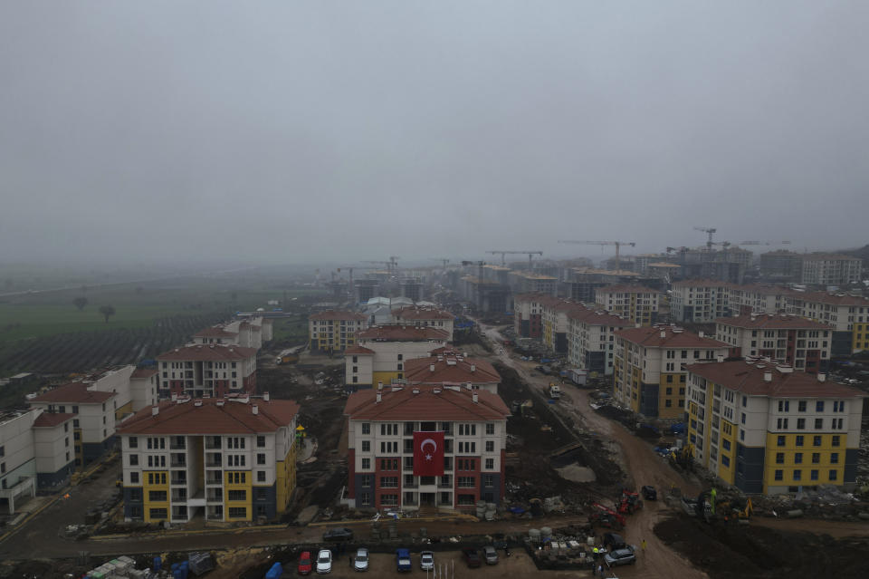 This Friday, Jan. 12, 2024 photo shows an arial view of a new housing project for earthquake survivors under construction on the outskirts of Antakya, southern Turkey. The government is rushing to build more than 300,000 homes for displaced families, most of whom are living in temporary shelters. (AP Photo/Khalil Hamra)