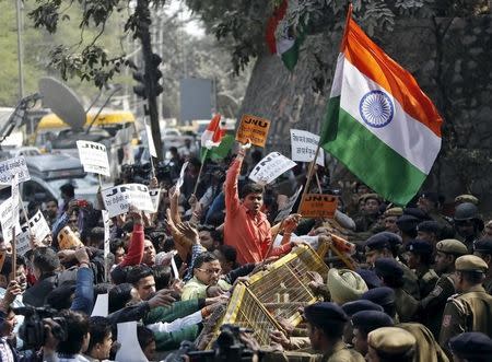 Activists from various Hindu right-wing groups shout slogans as they try to cross a police barricade during a protest against the students of Jawaharlal Nehru University (JNU) outside the university campus in New Delhi, India, February 16, 2016. REUTERS/Anindito Mukherjee