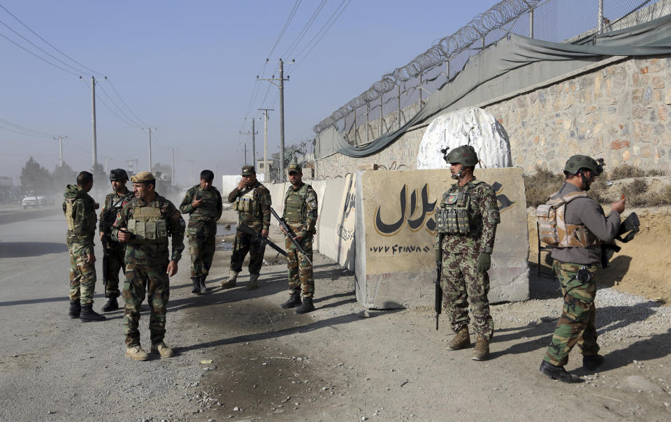 National army soldiers arrive at the site of explosions in front of the Kabul Military Training Center in Kabul, Afghanistan, Monday, Nov. 18, 2019. Back-to-back explosions early Monday targeting the military training center wounded Afghan national army soldiers, police and interior spokesmen said. (AP Photo/Rahmat Gul)