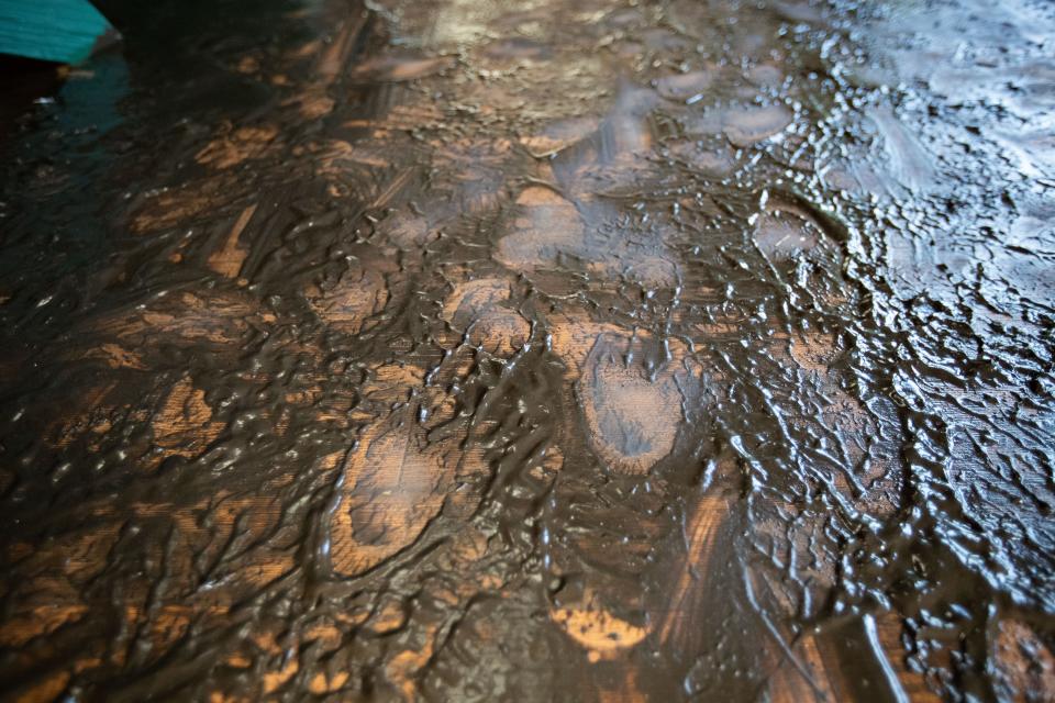 Mud coats the floor in Frank Couch's home in Suwannee, Fla. after Hurricane Idalia tore through the Nature Coast the day prior, Thursday, Aug. 31, 2023.