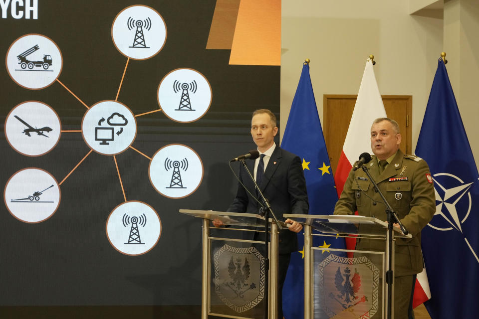 Polish armed forces' Chief of Staff. Gen Wieslaw Kukula, right , and Deputy Defense Minister Cezary Tomczyk, second right, speak about a program of strengthening the defense of NATO'S eastern flank in Warsaw, Poland, Monday, May, 27, 2024, during a presentation of a program to upgrade the security of Poland's border with Russia and Belarus, which is also European Union's eastern border. (AP Photo/Czarek Sokolowski)