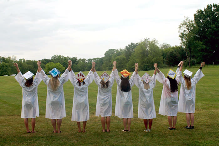 Paige Porter and her friends taking graduation photos.