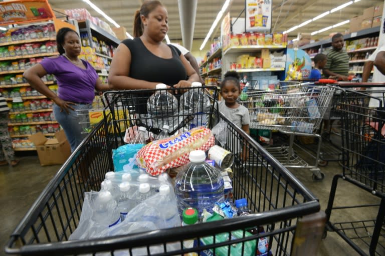 Residents stock up on food before the arrival of Hurricane Matthew, in Portmore, Jamaica, on October 1, 2016