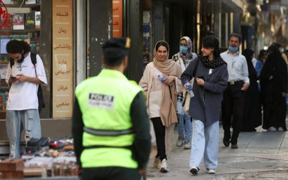 Iranian women risk uncovering their heads in Tehran after morality police were reinforced in 2023