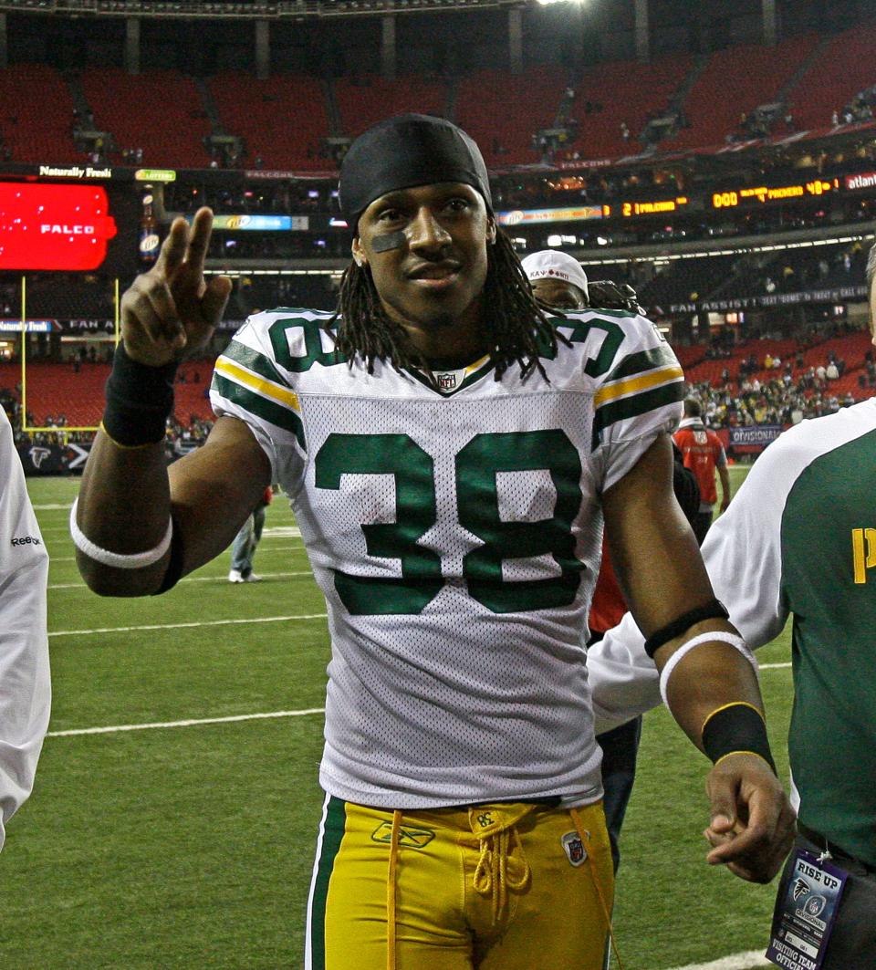 Green Bay Packers cornerback Tramon Williams waves to fans after beating the Atlanta Falcons in 2011.