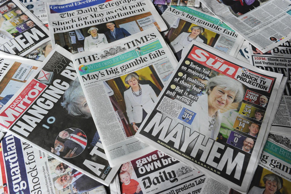 <p>British daily newspapers showing front page stories about the exit poll results of the snap general election in London on June 9, 2017. (Photo: Daniel Sorabji/AFP/Getty Images) </p>