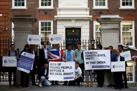 Conservative party members stage a demonstration outside the party's headquarters in London
