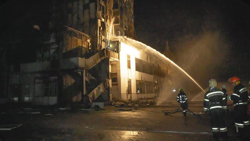 In this photo provided by the Odesa Region Administration, firefighters work to extinguish a fire in a hotel at the seaport after a Russian rocket attack in Odesa, Ukraine, Monday, Sept. 25, 2023.