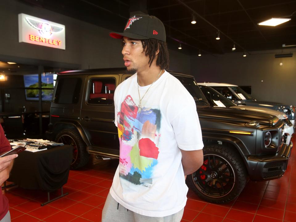 Ohio State quarterback CJ Stroud talks to the media after taking delivery of his Mercedes at Sarchione Auto Gallery in Jackson Township on Wednesday, June 8, 2022.