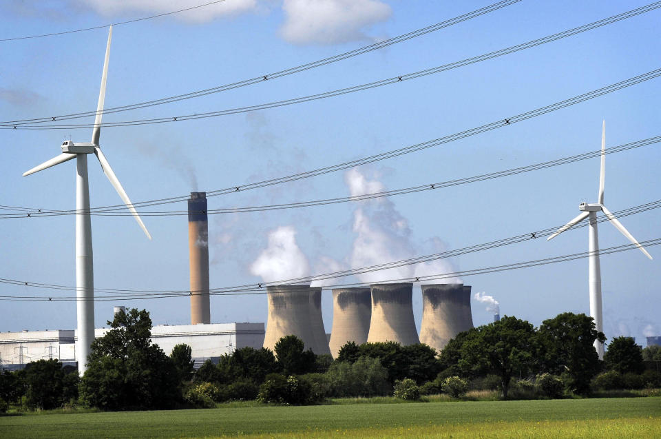 A general view of wind turbines in East Yorkshire against a backdrop of Drax power station.