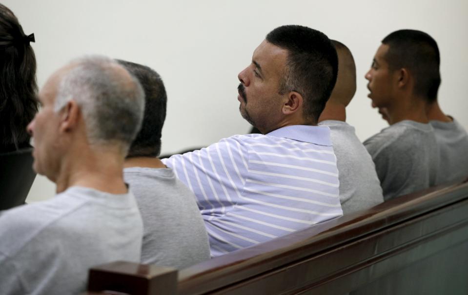 Six men accused of the kidnapping and killing of 11 women listen to the verdict at a court room in the Mexican border city of Ciudad Juarez, Mexico July 27, 2015. Local media reported that the court convicted five of them to 697 years in prison for each of the men after convicting them of prostituting the women, kidnapping and murder and whose bodies were found at El Navajo creek. REUTERS/Jose Luis Gonzalez