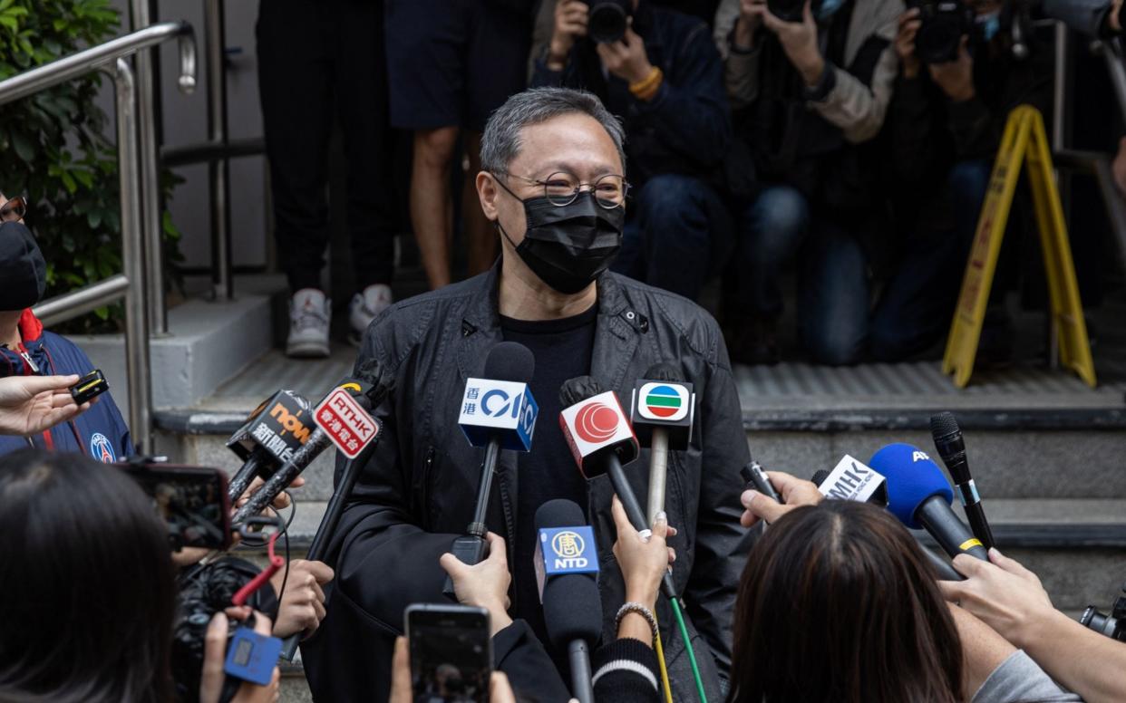 Hong Kong legal scholar and democracy activist Benny Tai Yiu-ting speaks to the press as he prepares to report to the Ma On Shan Police Station in Hong Kong - JEROME FAVRE/EPA-EFE/Shutterstock/Shutterstock