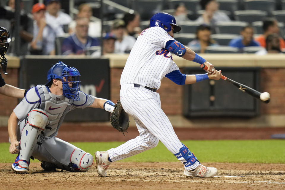 New York Mets' Luis Guillorme hits a walk-off RBI single during the tenth inning of the baseball game against the Los Angeles Dodgers at Citi Field, Sunday, July 16, 2023, in New York. The Mets defeated the Dodgers in extra innings 2-1. (AP Photo/Seth Wenig)