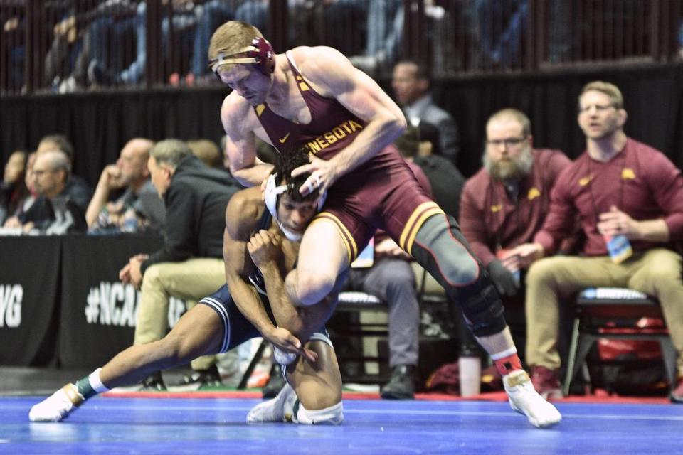 Penn State’s Carter Starocci aims to take down Minnesota’s Bailee O’Reilly in their 174-pound quarterfinals match of the NCAA Championships on Friday, March 17, 2023 at the BOK Center in Tulsa, Okla. Starocci beat O’Reilly, 5-2.