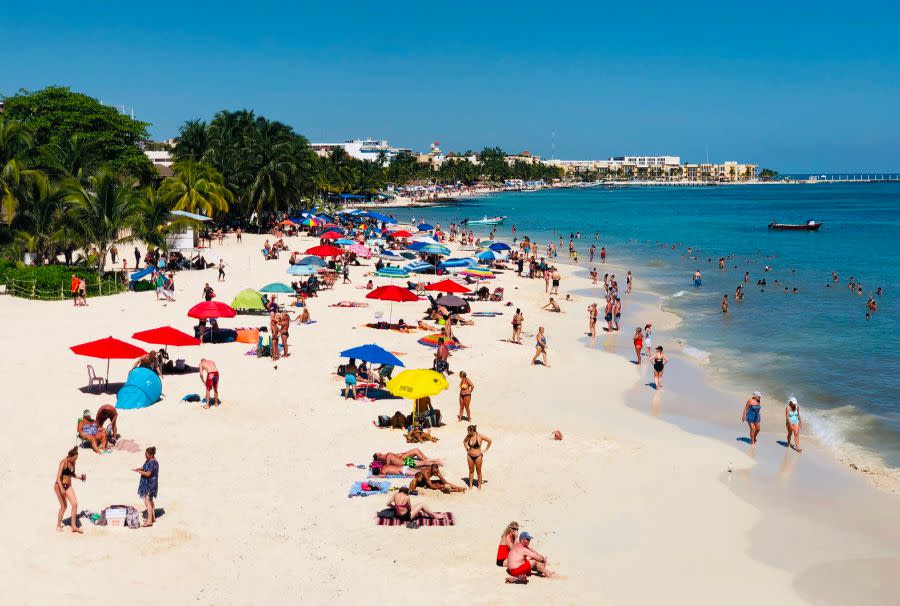 People enjoy a day on the beach in the seaside tourist resort of Playa del Carmen, Quintana Roo State, on February 15, 2019. – Playa del Carmen and nearby Cancun are the top tourist destinations in Mexico, famous for their turquoise waters and white-sand Caribbean beaches. (Photo by Daniel SLIM / AFP) (Photo credit should read DANIEL SLIM/AFP via Getty Images)