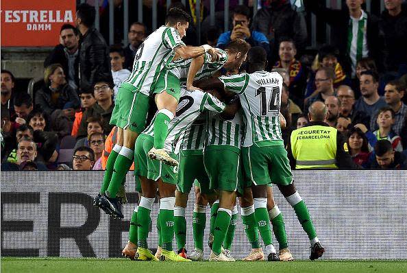 Real Betis players celebrate after scoring their third goal against Barcelona (Getty)