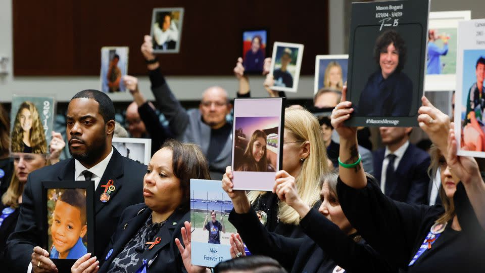 People hold up photographs and placards during the Senate Judiciary Committee hearing on online child sexual exploitation at the U.S. Capitol in Washington, U.S., January 31, 2024. - Evelyn Hockstein/Reuters