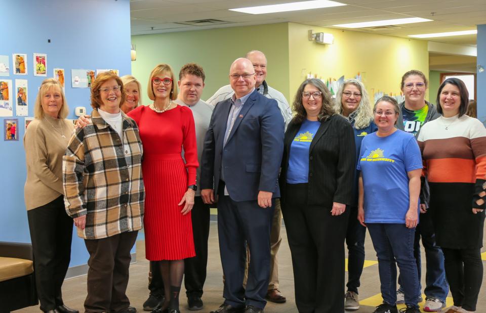 Shine On University Board Member Peni Satterfield, MaryAnn Grove, Debra Wilson, Indiana’s Lieutenant Gov. Suzanne Crouch, Shine On University student Nathan Wilson, Tippecanoe County Commissioner Tracy Brown, Shine On University Board Member Dave Mecklenburg, Shine On University staff member Gena Carson, Roxanne Logan, Jennifer Robbins, Heather Hutcheson, and Shelley Mitchell poses for a photo during a Crouch's visit to Lafayette, on Saturday, Jan. 28, 2023.