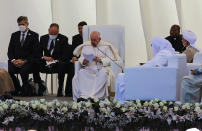 Pope Francis, center, speaks during an interreligious meeting near the archaeological site of Ur near Nasiriyah, Iraq, Saturday, March 6, 2021. Pope Francis and Iraq's top Shiite cleric delivered a powerful message of peaceful coexistence Saturday, urging Muslims in the war-weary Arab nation to embrace Iraq's long-beleaguered Christian minority during an historic meeting in the holy city of Najaf. (AP Photo/Nabil al-Jourani)