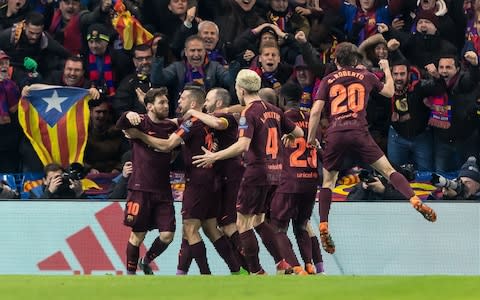 Barcelona players gather around Messi - Credit: Getty Images