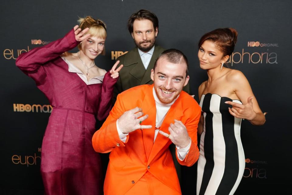 <div class="inline-image__caption"><p>Hunter Schafer, Sam Levinson, Angus Cloud, and Zendaya attends HBO’s <em>Euphoria </em>Season 2 Photo Call at Goya Studios on Jan. 5, 2022, in Los Angeles, California. </p></div> <div class="inline-image__credit">Jeff Kravitz/Getty</div>