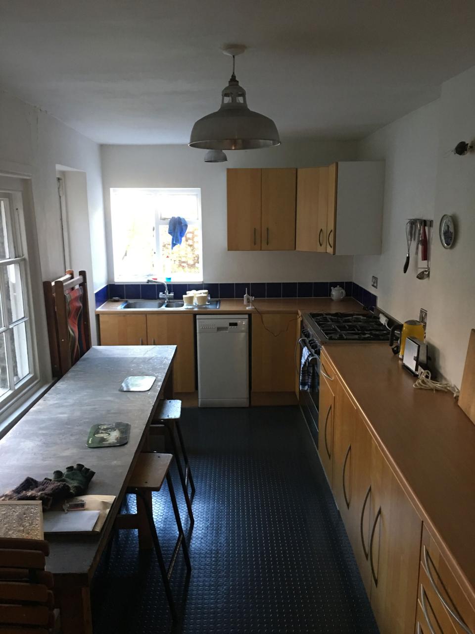 Before: The original kitchen was dark, tight, and closed off from the rest of the house.